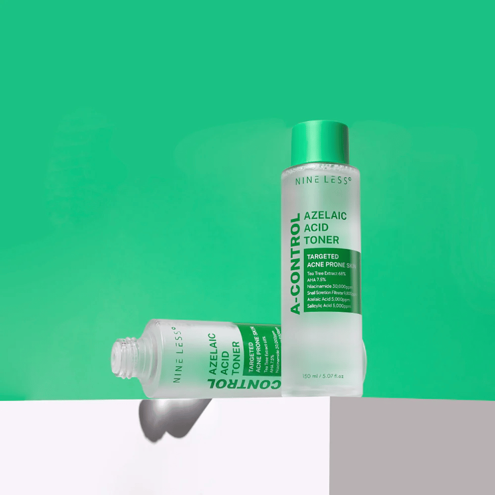 Two bottles of Nine Less A-Control Azelaic Acid Toner placed against a green background, one standing and one lying down.