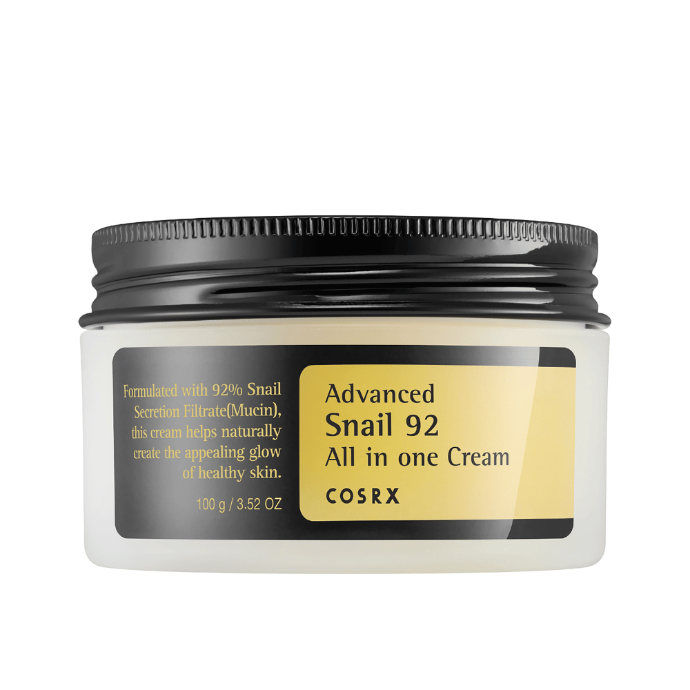Foreground view of a closed COSRX Advanced Snail 92 All in one Cream jar with a black lid and yellow label on a white background.