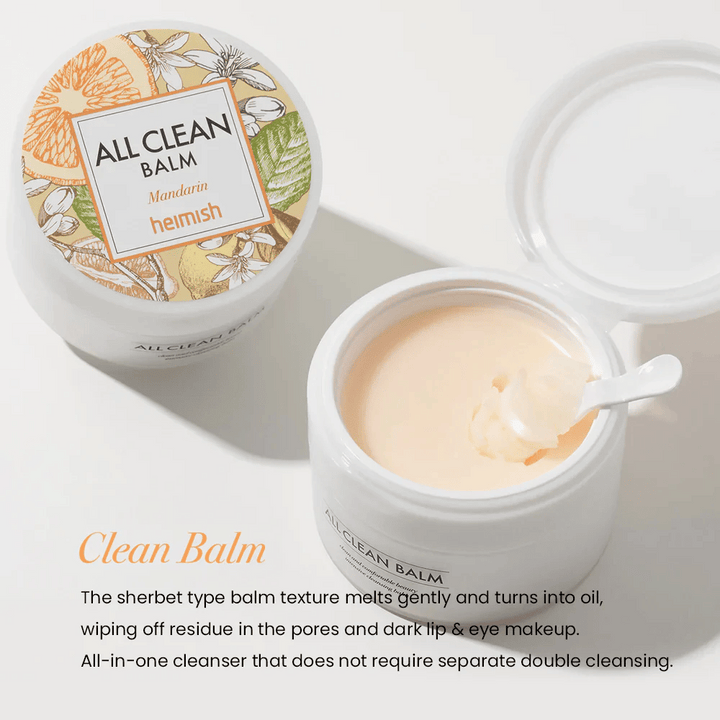 Öppen burk av Heimish All Clean Balm Mandarin med en sked som rör om den krämiga rengöringsbalmen, med en färgglad etikett och texten 'Clean Balm' i förgrunden.