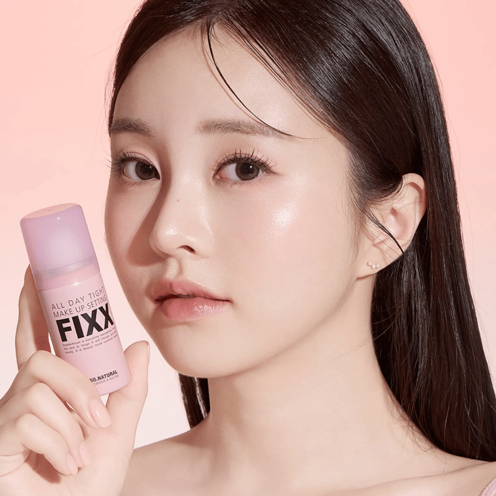 2. So Natural All Day Tight Make Up Setting Fixx – model with pink makeup setting spray for long-lasting makeup