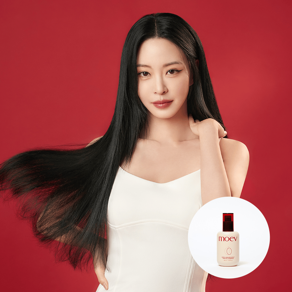 Woman with long, shiny hair shows the result of MOEV Annurcatin Hair Oil Essence – Korean hair oil that moisturizes and combats frizz for silky smooth hair.
