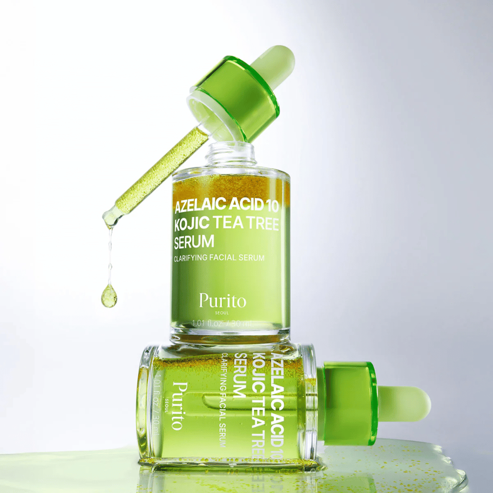 Purito Azelaic Acid 10 Kojic Tea Tree Serum – fresh green formula with drop from pipette showing the light texture of the serum.