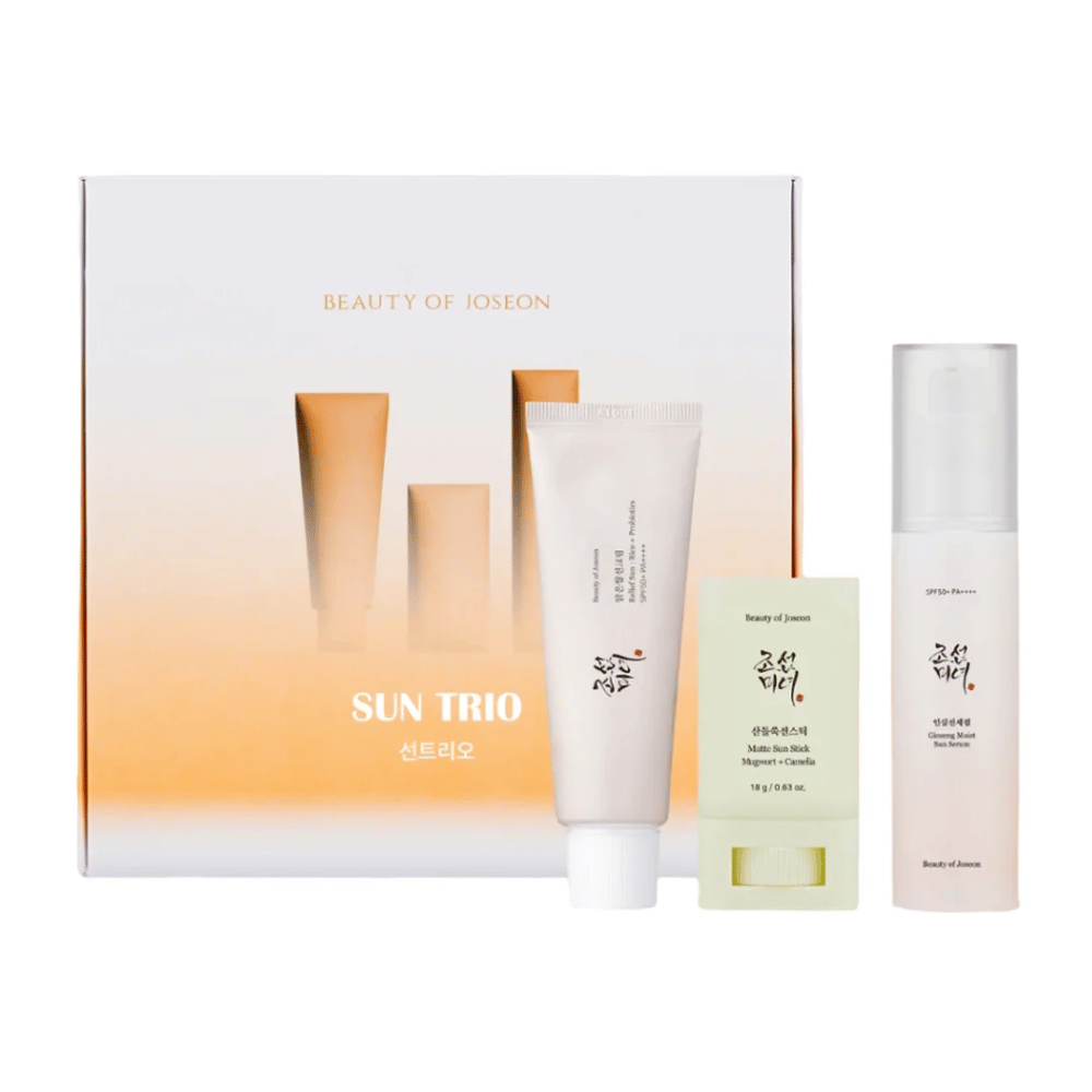 Beauty of Joseon - Sun Trio gift set with three sun protection products: Relief Sun Rice + Probiotics, Matte Sun Stick Mugwort + Camellia and Ginseng Moist Sun Serum in front of a gradient packaging in white and orange.