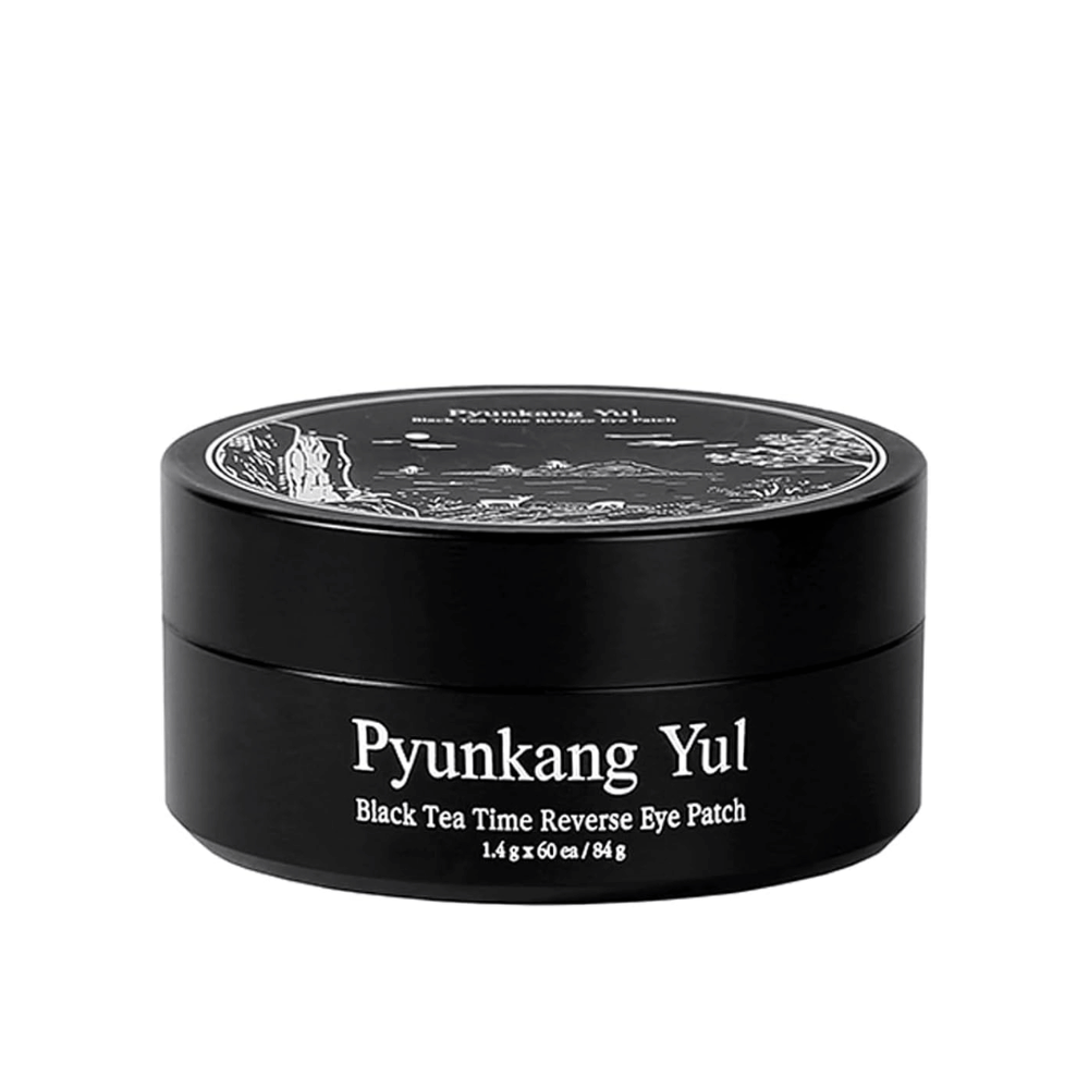 Cut-out product image of Pyunkang Yul Black Tea Time Reverse Eye Patch in black packaging with a sleek and minimalist design against a light background.