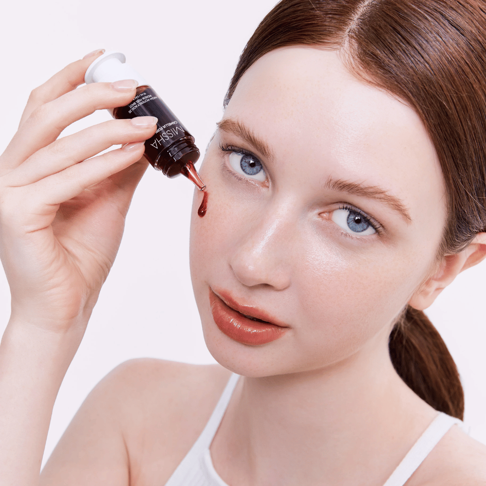 5. MISSHA Camellia PDRN NAD+ High-Potency Acid 25 Renew Peel Shot – facial peeling with red formula applied to the skin