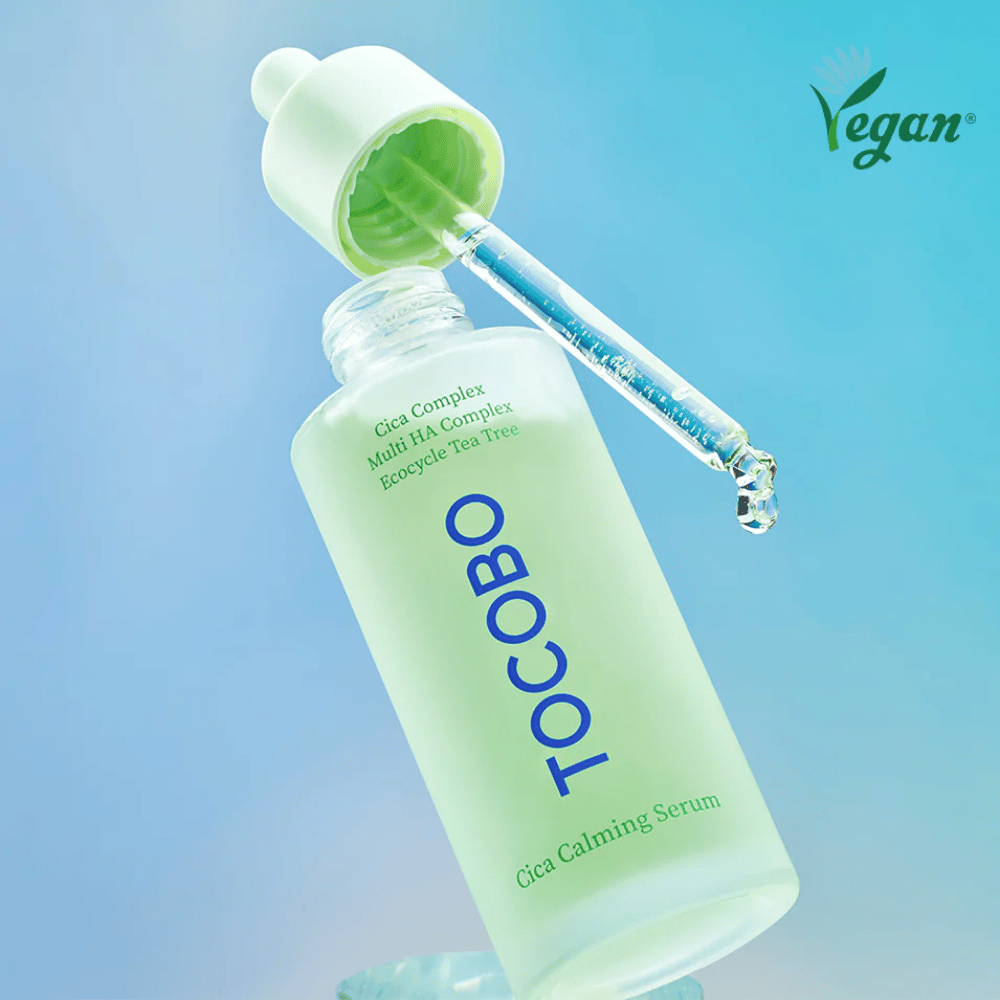 TOCOBO Cica Calming Serum with pipette against a blue background, easily absorbed K-beauty serum that strengthens the skin barrier and suits sensitive, oily, and acne-prone skin.