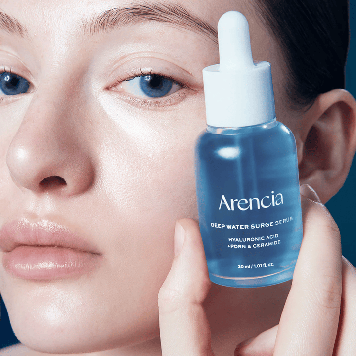 Model applies Arencia Deep Water Surge Serum – hydrating Korean serum with hyaluronic acid, PDRN and ceramides that soothe sensitive skin and strengthen the skin barrier.