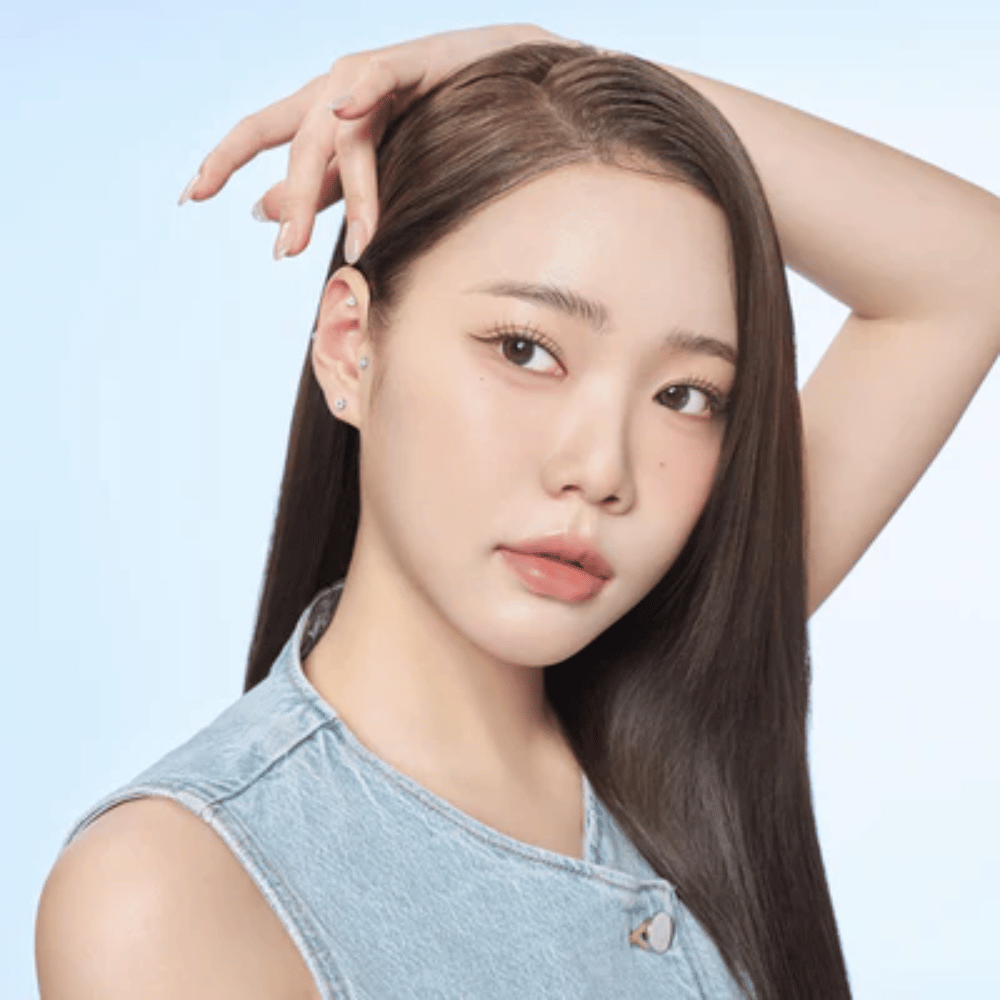 Model wearing RETURNITY Ear Therapy Acupressure Patch on the ear, showing how the patches look when used.
