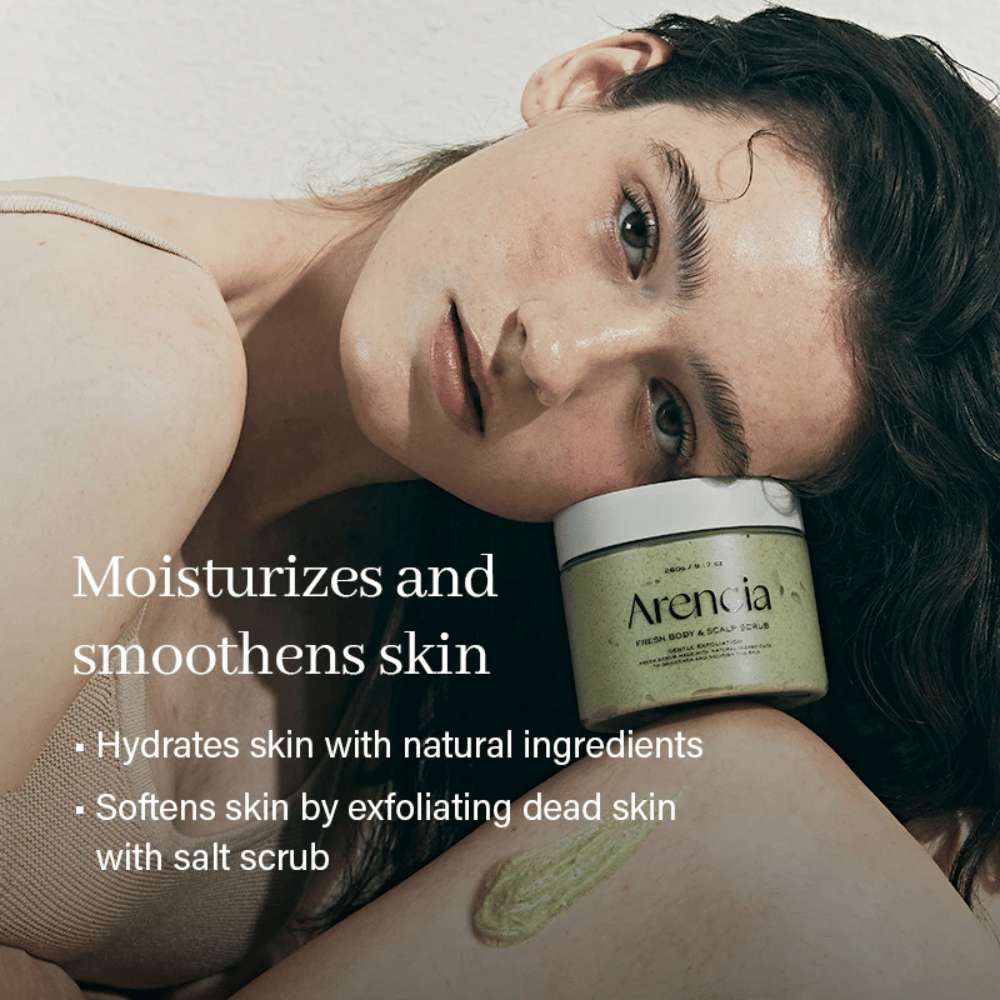 Model resting against Arencia body scrub, moisturizing body scrub that softens the skin and removes dead skin cells.