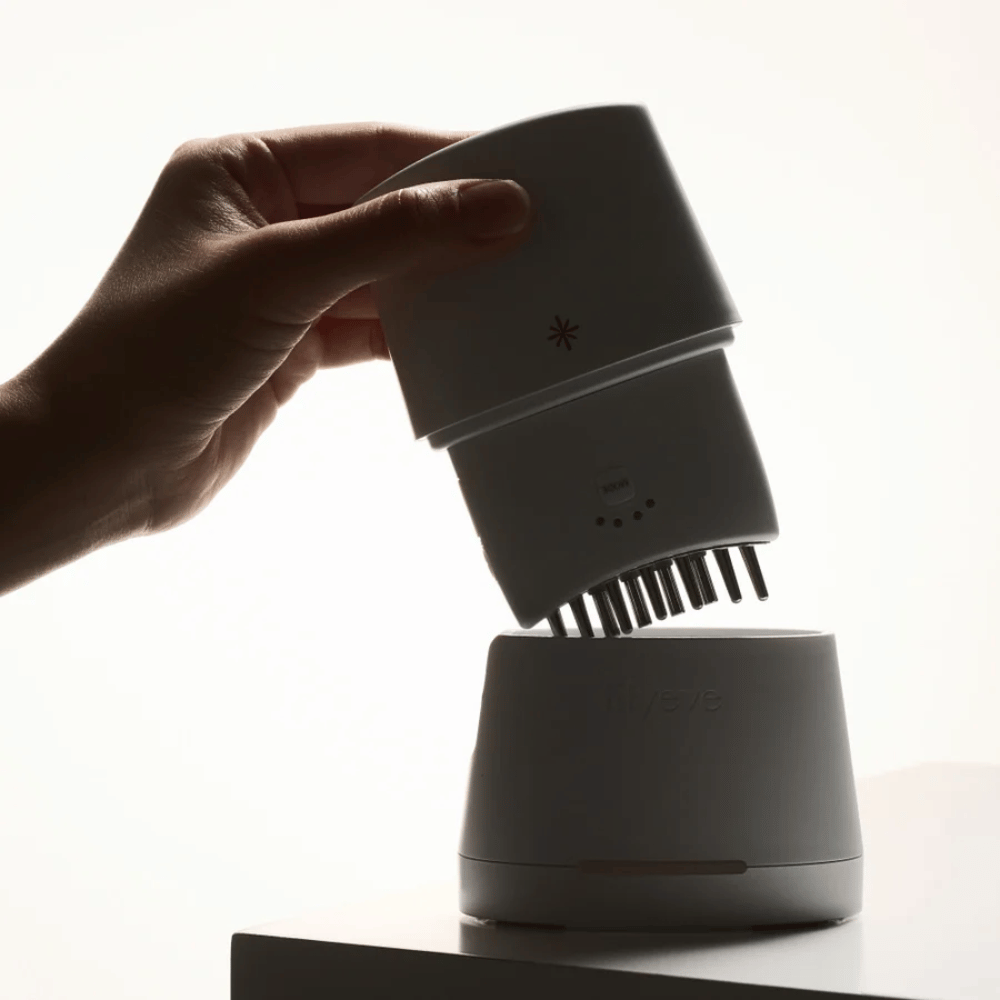 1. Lilyeve GrowTurn Pro – white scalp device with detachable massage head and charging station