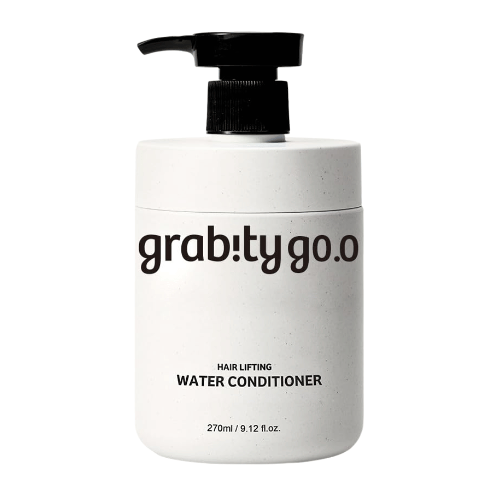 Grabity Hair Lifting Water Conditioner in a sleek white pump bottle against a light background. A volumizing hair conditioner formula developed to provide softness, shine, and a fuller-looking hair appearance.