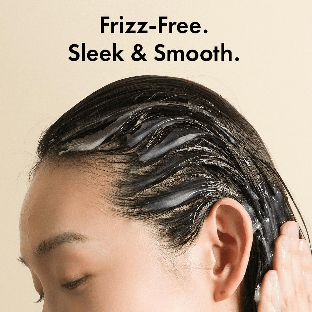 Person applying Grabity Hair Lifting Water Conditioner to wet hair. The lightweight formula coats the hair strands to reduce frizz and leave hair softer, smoother, and more well-cared-for.