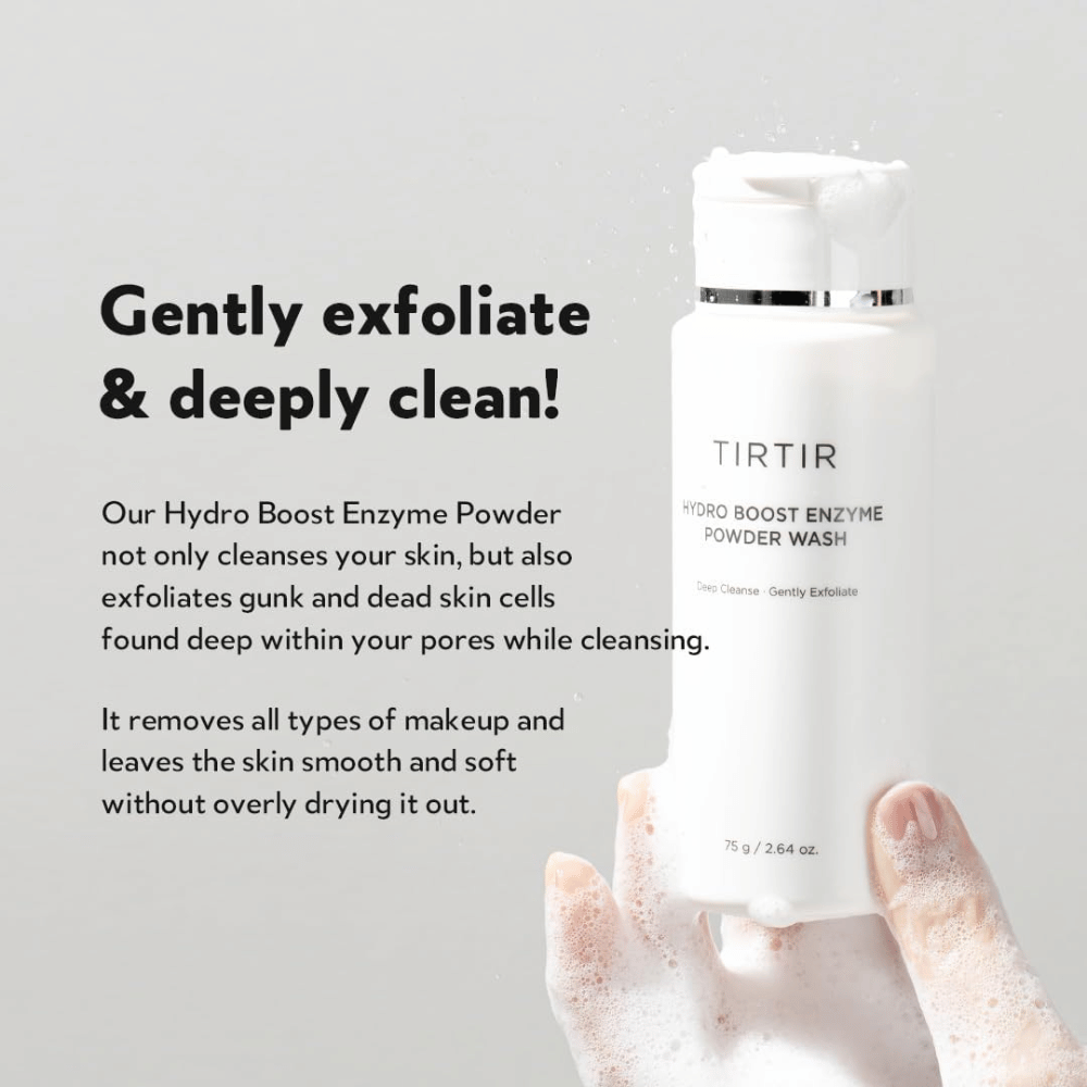 A hand holds a bottle of TIRTIR Hydro Boost Enzyme Powder Wash, a skincare product that exfoliates and deeply cleanses. The bottle is white with text and a white foam forms in the hand.