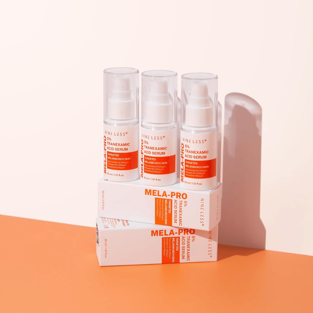 Three NINE LESS MELA-PRO 5% Tranexamic Acid Serum 30 ml, brightening serum with niacinamide and glutathione for melanin-rich skin.