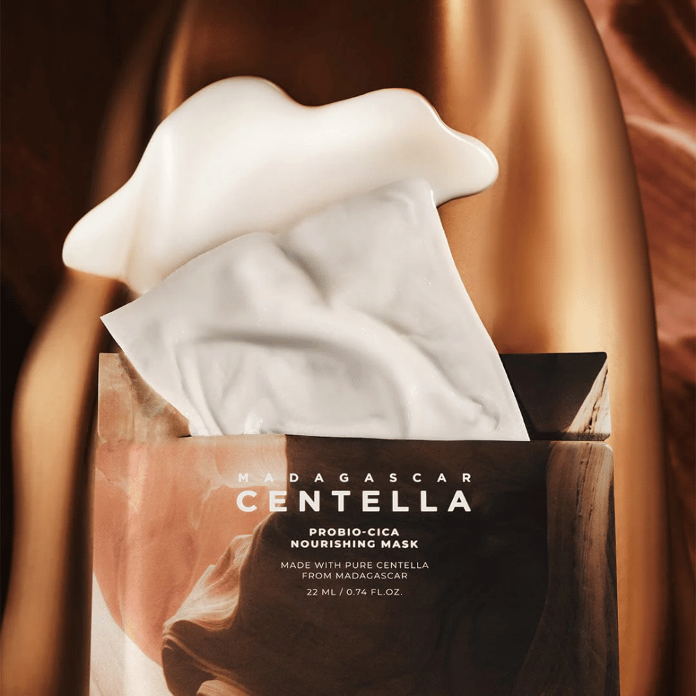 Packaging with pulled-out Sheet mask showing rich essence and a moisturizing effect.