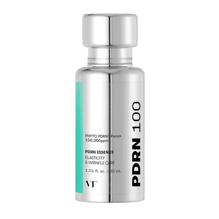 VT PDRN 100 Essence i en silverfärgad flaska med text som anger innehåll: 100,000 ppm PHYTO PDRN® Panax för elasticitet och rynkvård. Flaskan rymmer 30 ml och har en elegant, spegelblank design.