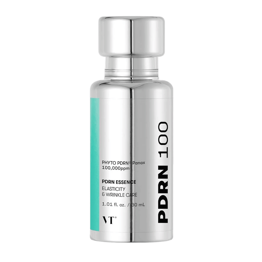 VT PDRN 100 Essence i en silverfärgad flaska med text som anger innehåll: 100,000 ppm PHYTO PDRN® Panax för elasticitet och rynkvård. Flaskan rymmer 30 ml och har en elegant, spegelblank design.