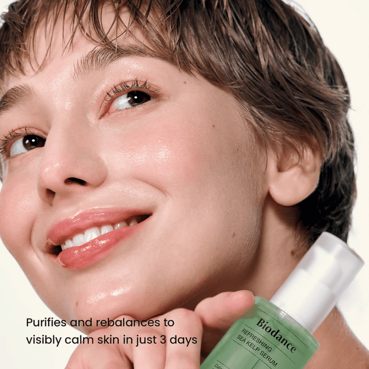 Woman with clear and balanced skin uses Biodance Sea Kelp Serum – visibly soothing effect.