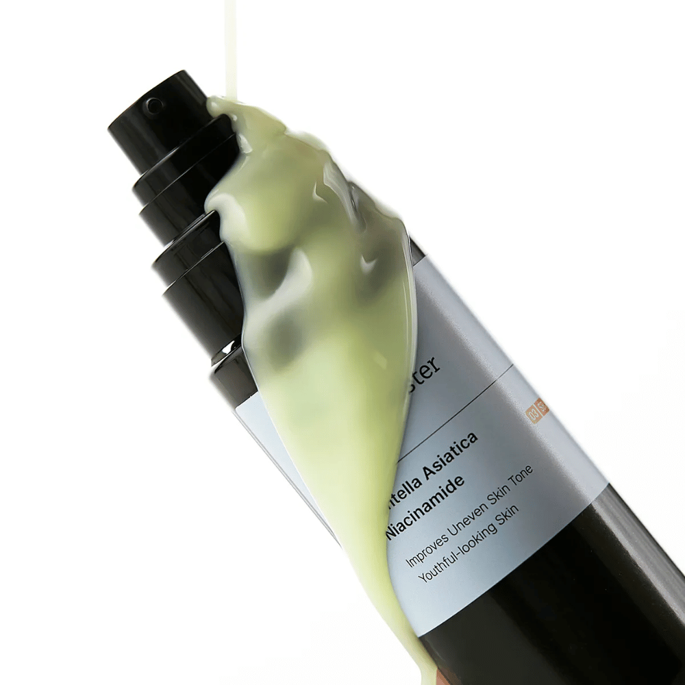 Close-up of Meditherapy Retinal Skin Booster Serum with yellow-green formula flowing over the bottle – an active blend of retinal, niacinamide, and centella.
