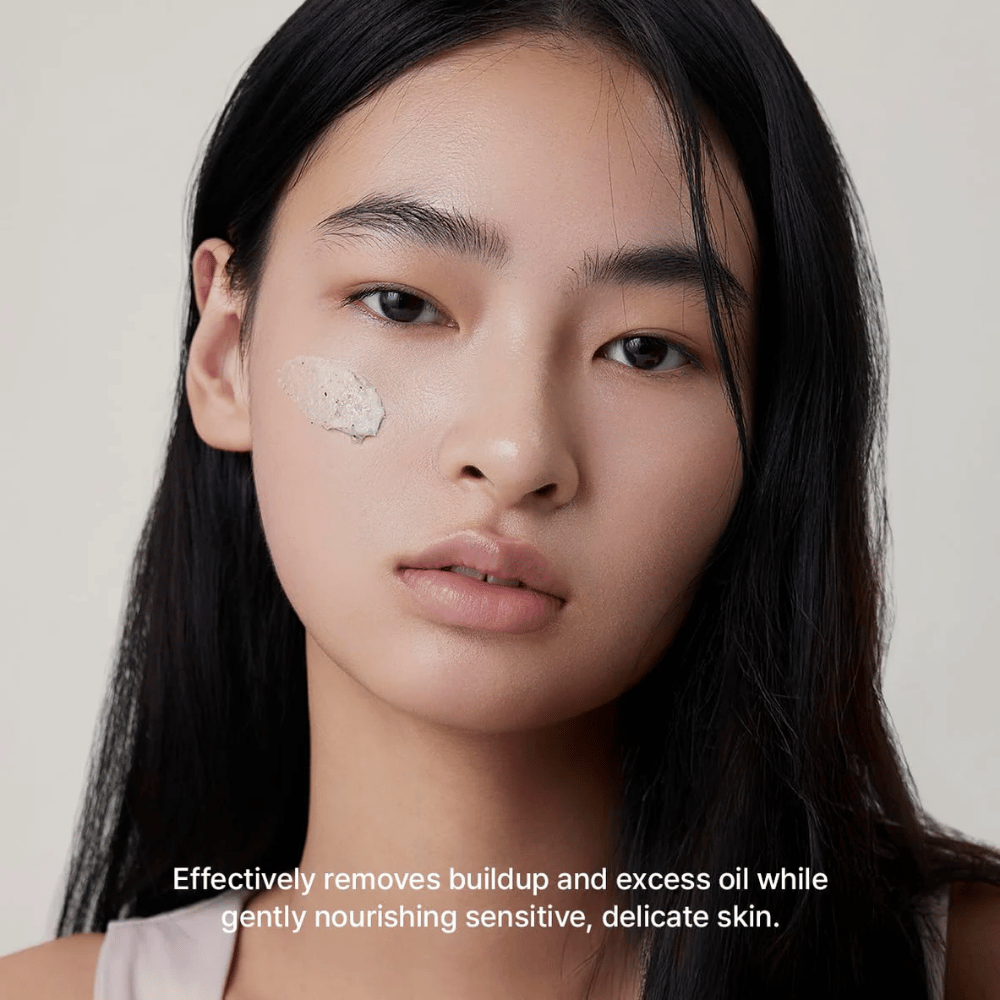 Model with Arencia Rice + LHA Pore Control Rice Cake Cleanser applied on the cheek, mild face wash that effectively removes dirt and excess sebum without drying out the skin.
