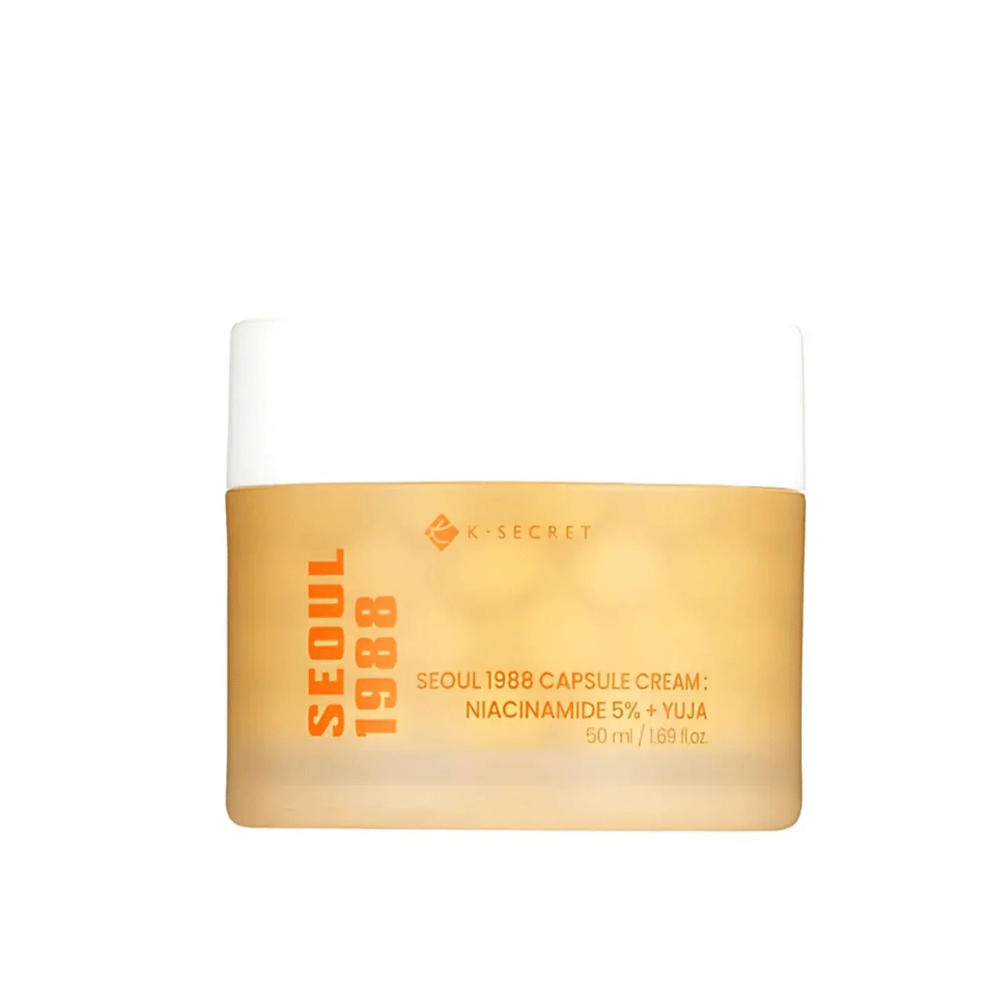 Burk med K-Secret Seoul 1988 Capsule Cream Niacinamide 5% + Yuja, 50 ml, i guldfärgat designat emballage.