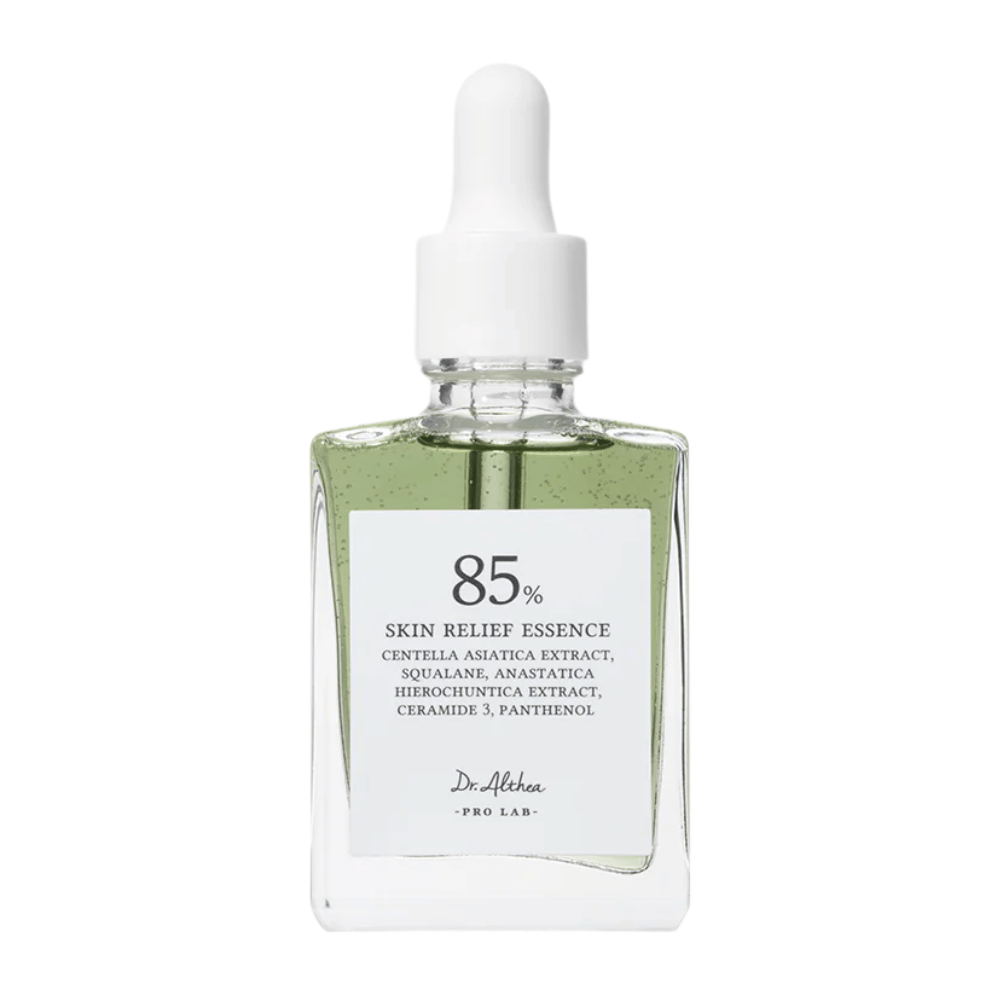 Dr. Althea 85% Skin Relief Essence in a sleek glass bottle with a white dropper. Contains centella asiatica, ceramides, and panthenol to soothe and restore the skin.