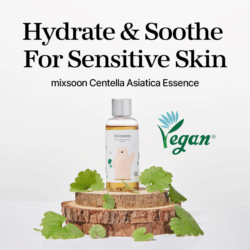 Mixsoon Centella Asiatica Essence with vegan label, bottle placed on wooden plate with green leaves, text “Hydrate & Soothe For Sensitive Skin.”