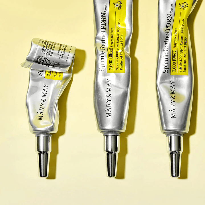 MARY & MAY Spicule Retinol PDRN Cream with visible usage in a tube, showing the cream's consistency and targeted applicator for precise application on the skin.