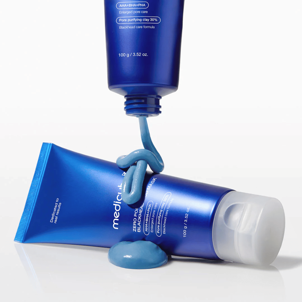 Two tubes of mud mask, blue product textured outside the packaging.