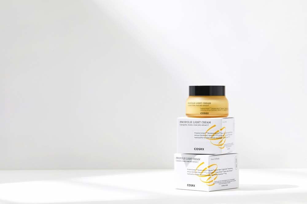 A bunch of COSRX Full Fit Propolis Light Cream 65 ml boxes.