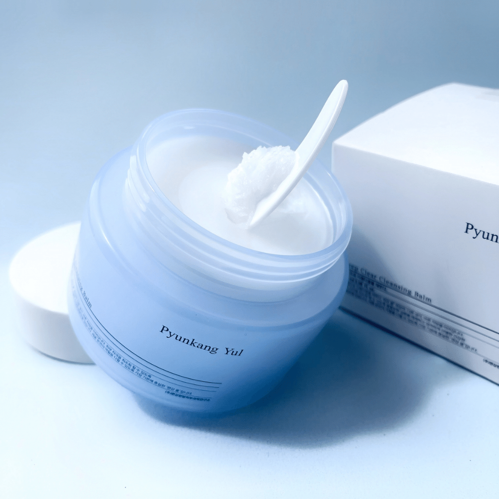 A jar Pyunkang Yul Deep Clear Cleansing Balm 100ml with a spoon beside it.
