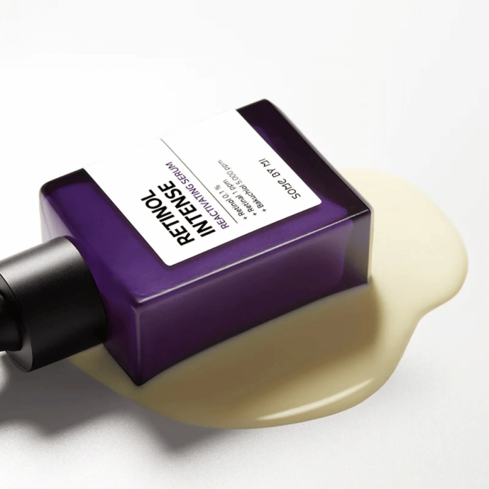 A bottle of SOME BY MI Retinol Intense Reactivating Serum 30ml sitting on a white surface.